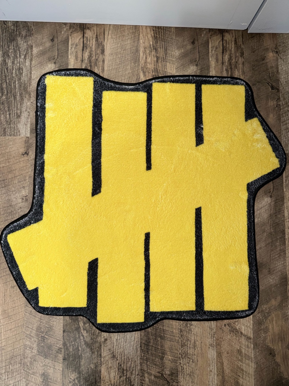 Undefeated Yellow and Black Tufted Rug